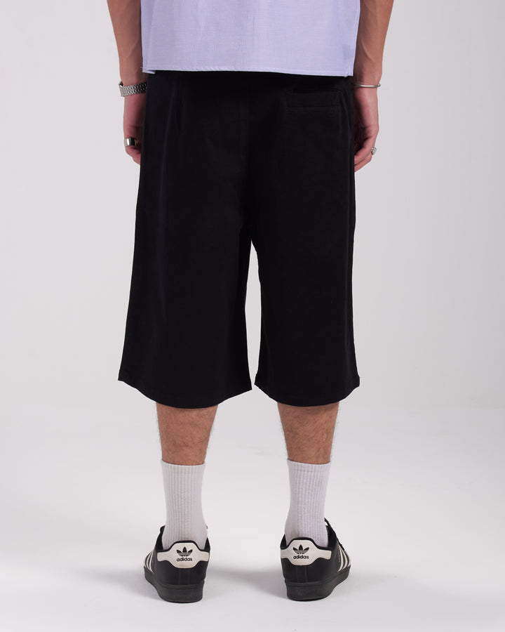 Black pleated shorts